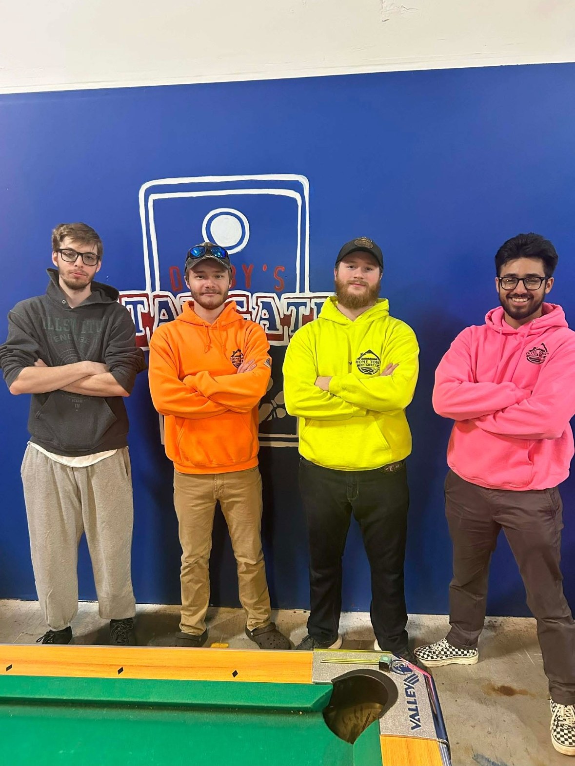 Four members of the Home Town Lawn Care crew